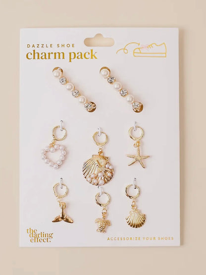 Shoe charm pack with various charms on a beige background
