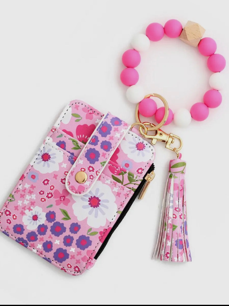 Floral phone case with matching keychain on a white background