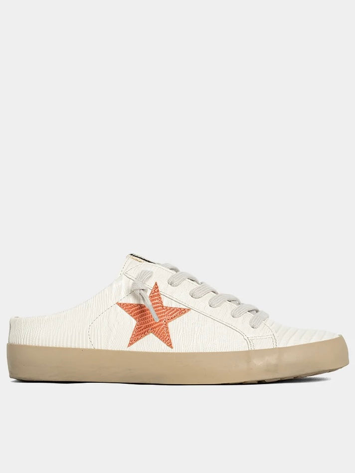 White sneaker with a red star on a white background
