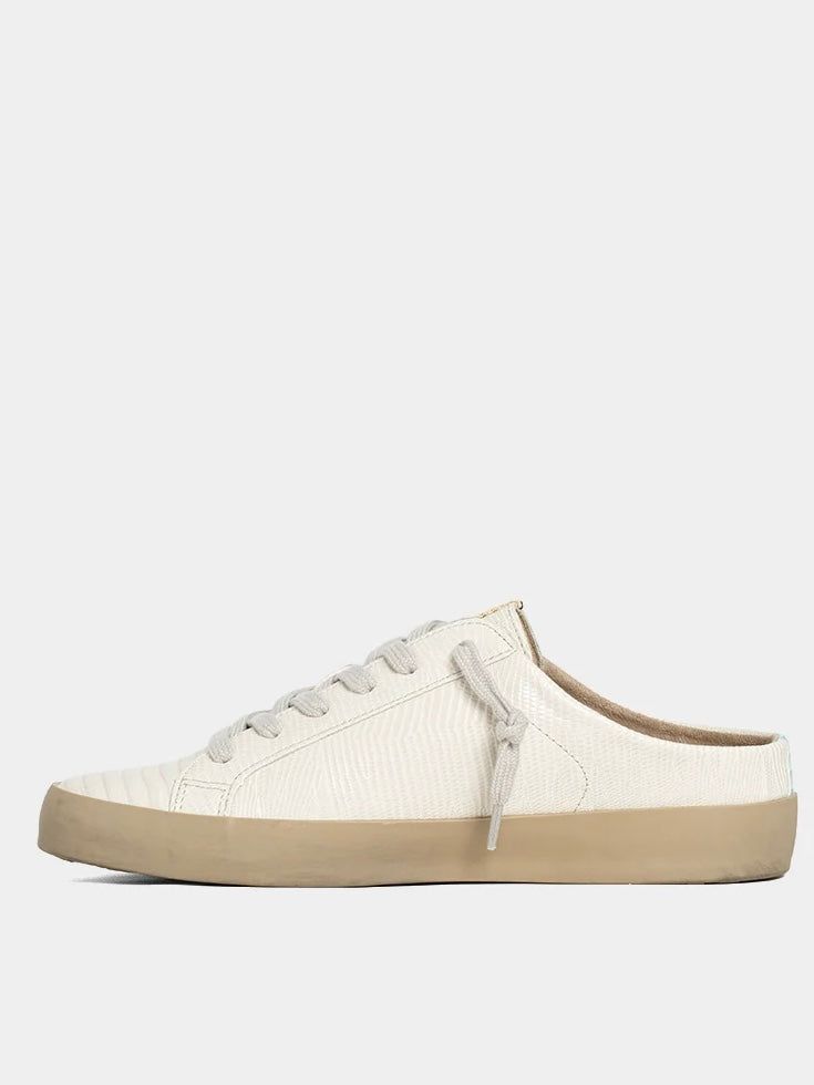 White sneaker with beige sole on a white background