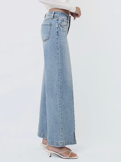 Light blue wide-leg jeans worn by a person on a white background