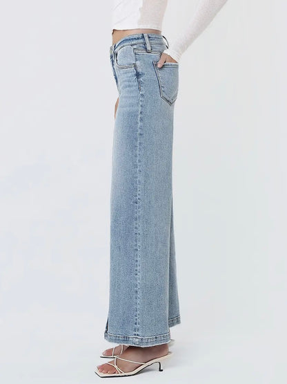 Light blue jeans worn by a person on a white background
