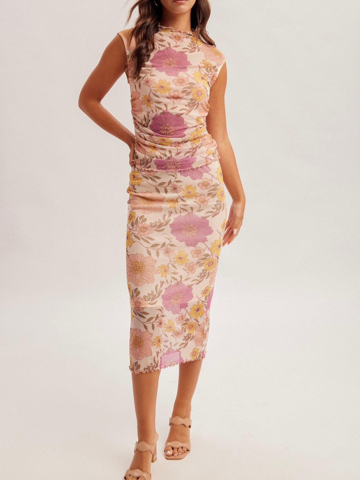 Woman wearing a floral dress on a white background