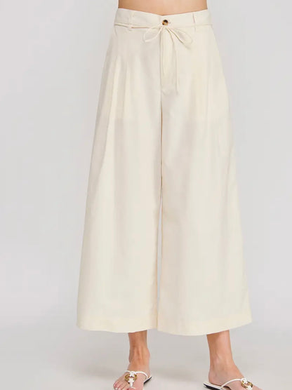 Beige wide-leg pants on a white background