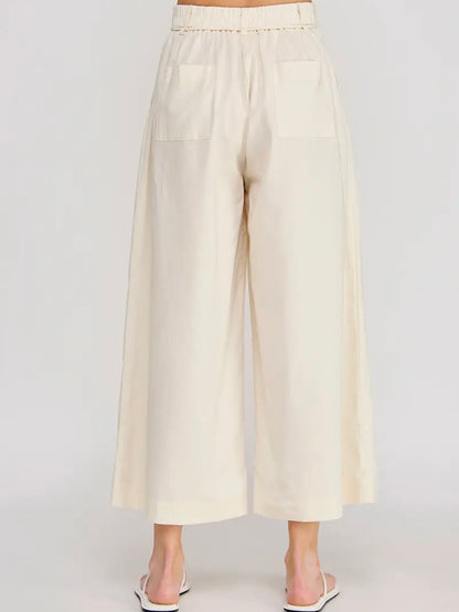 Beige wide-leg pants on a white background
