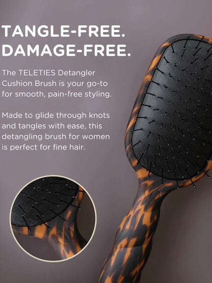 A hair detangling brush with a tortoiseshell-patterned handle and black cushioned bristle head, shown on a dark mauve background with promotional text and a circular detail inset.