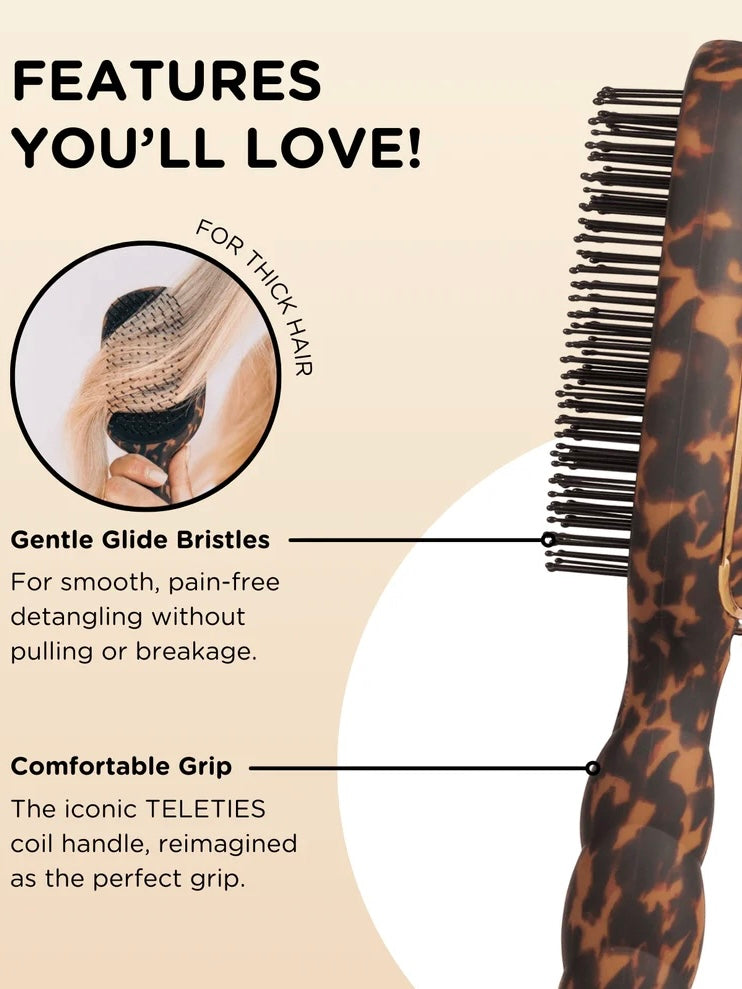 A hairbrush with a tortoiseshell handle and black bristles shown on a beige promotional graphic with text callouts about gentle glide bristles and a comfortable grip.