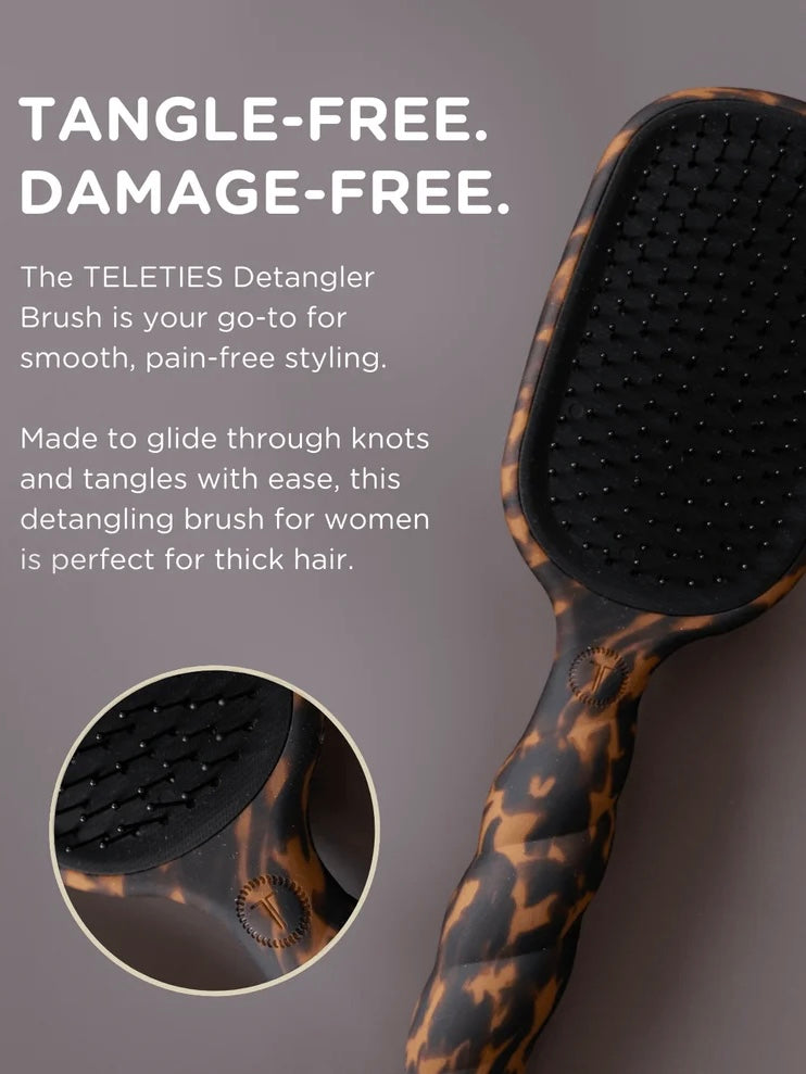 A hair detangling brush with a tortoiseshell pattern handle and black bristle head, shown on a dark gray background with promotional text and a circular inset detail of the bristles.