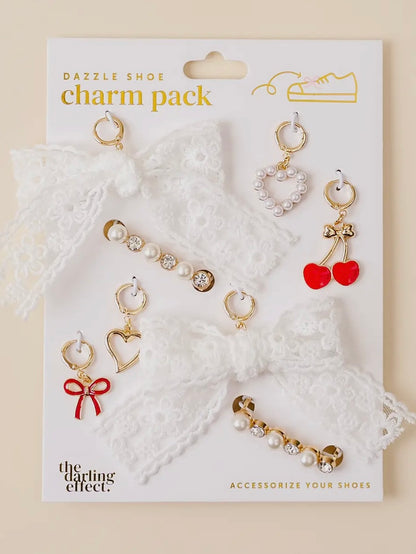 Charm pack with various charms on a white card, featuring 'The Darling Effect' branding.