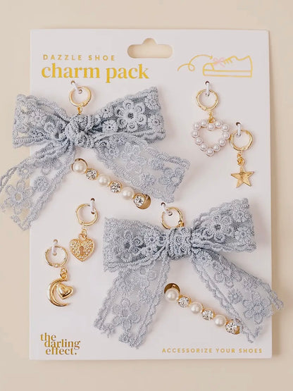 Charm pack with lace bow and decorative charms on a white card, featuring 'The Darling Effect' brand.