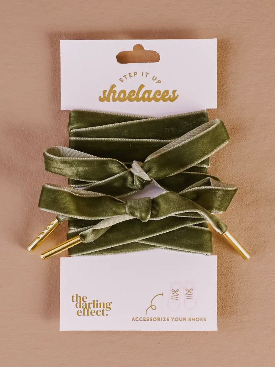 Green shoelaces on a beige background with 'Step It Up Shoelaces' packaging.
