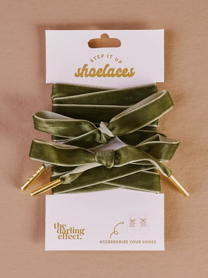 Green shoelaces on a beige background with 'Step It Up Shoelaces' packaging.